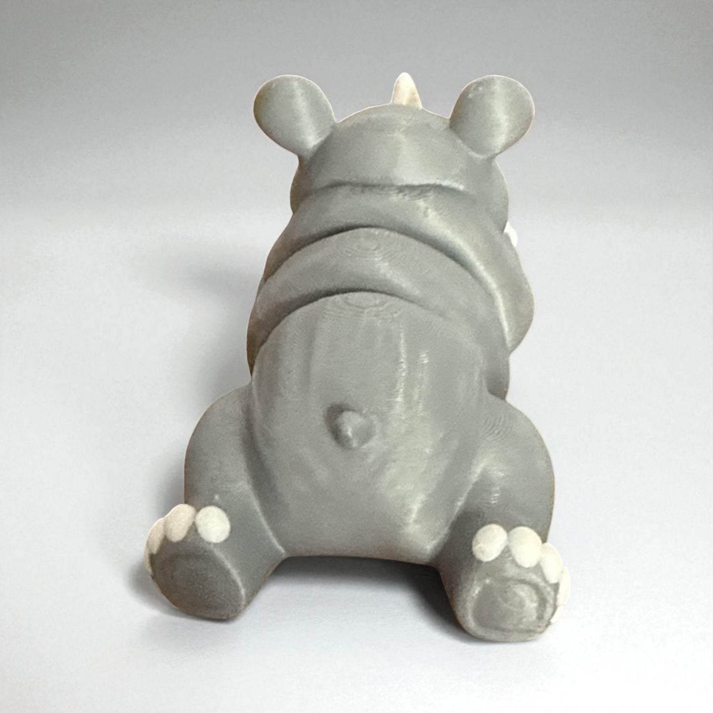 Cute Baby Rhino Articulated Figurine Adorable Wildlife Companion with Big Eyes and White Paws Perfect for Kids Room Decor