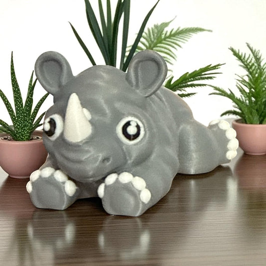 Cute Baby Rhino Articulated Figurine Adorable Wildlife Companion with Big Eyes and White Paws Perfect for Kids Room Decor