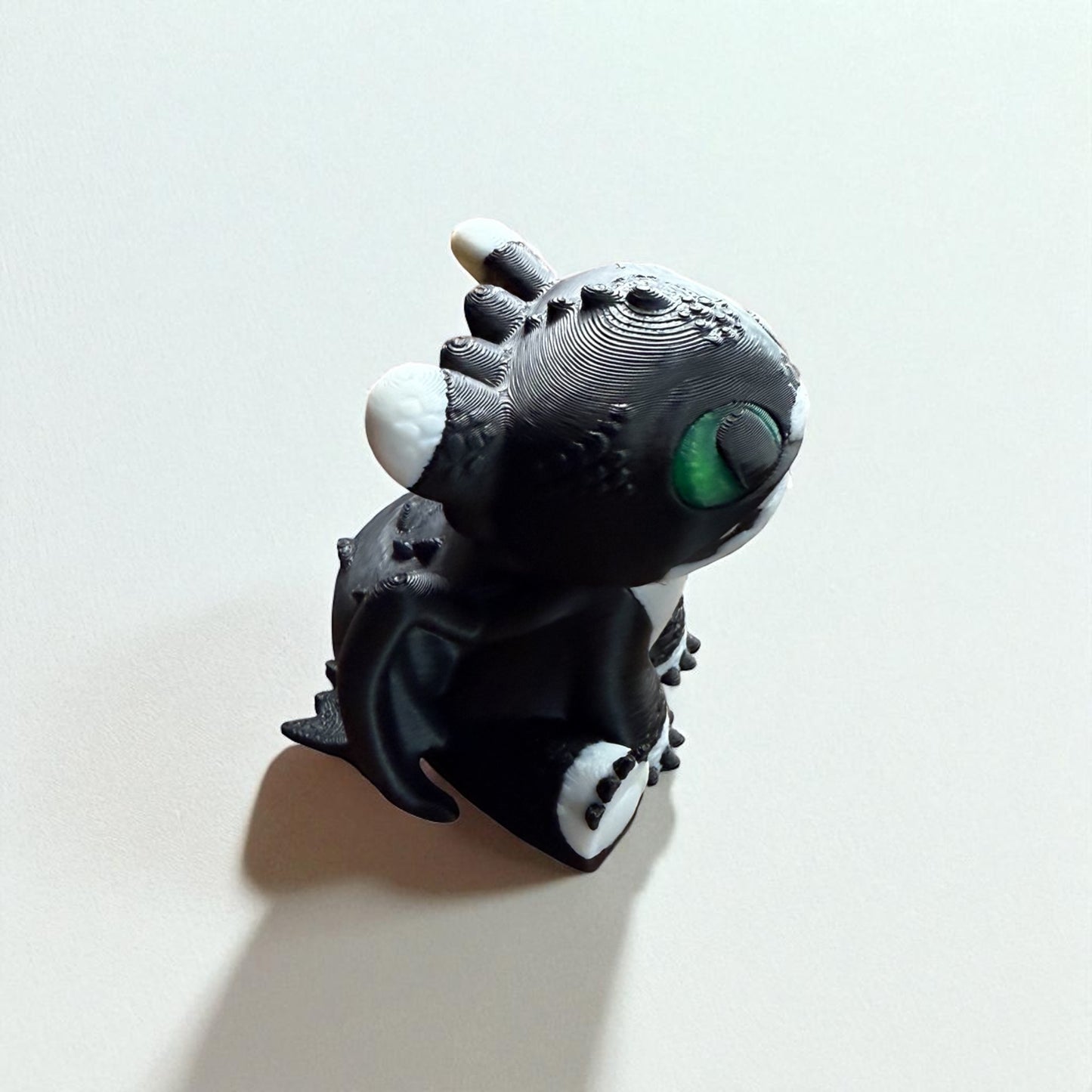 Toothless the Night Fury – Adorable Black Dragon Figurine with Green Eyes